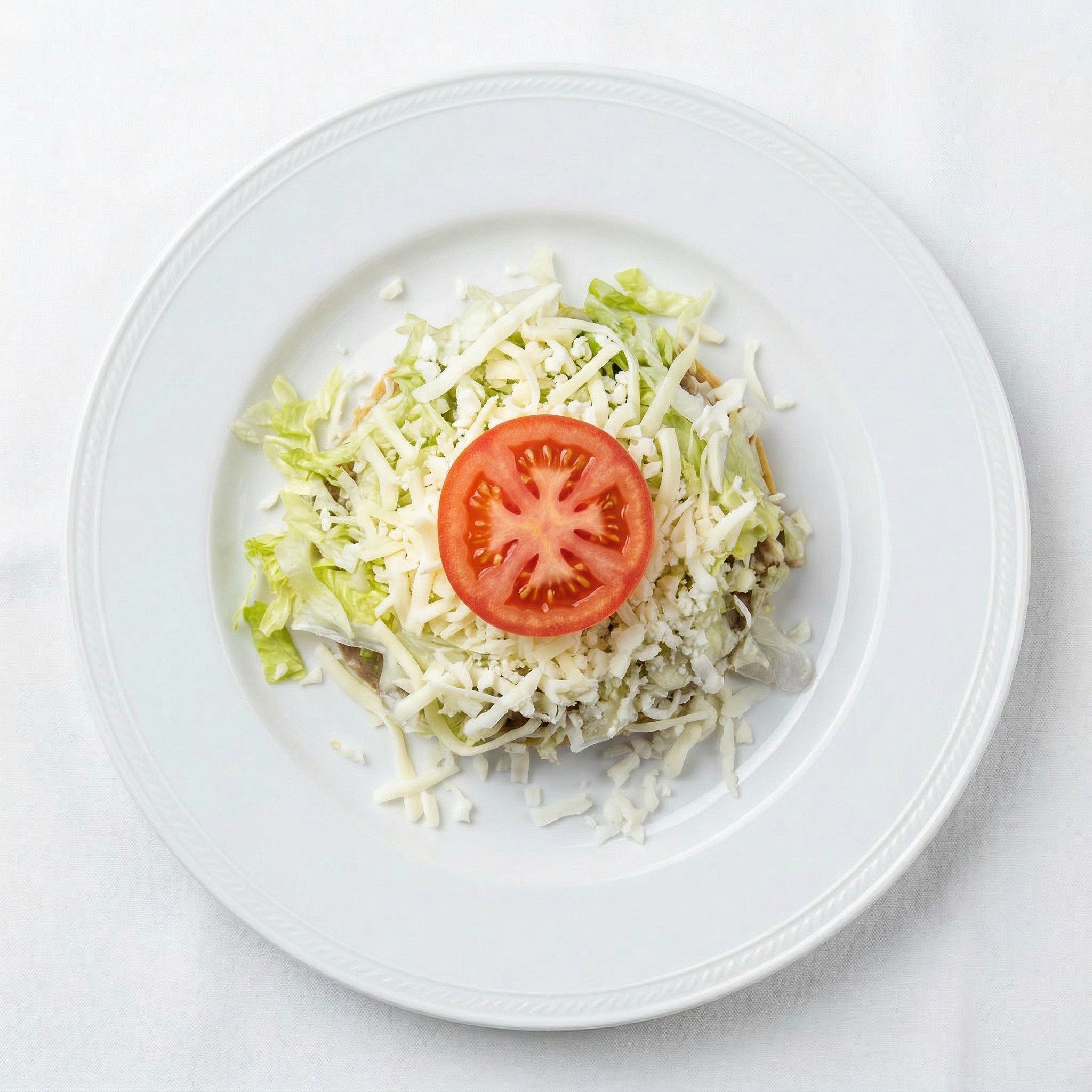 Tostada De Frijoles Y Queso.