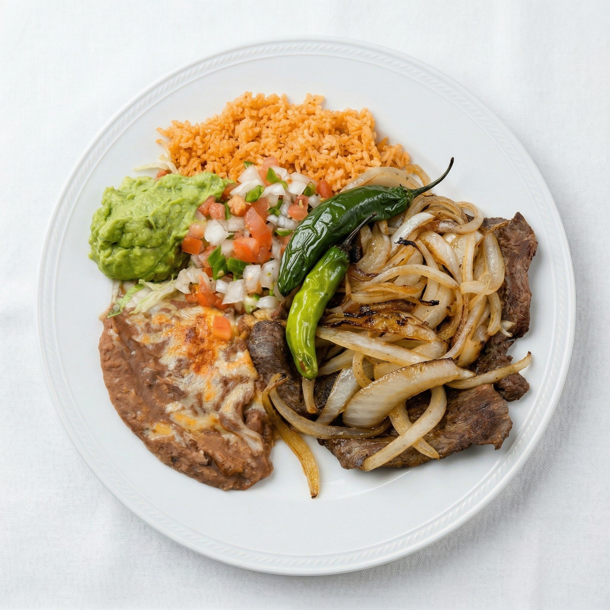 Bisteak Encebollado.