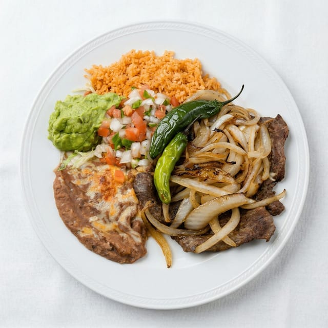 Bisteak Encebollado.
